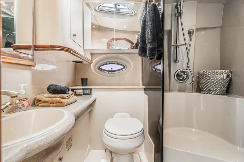 My Jojo Yacht Photos Pics Luxurious bathroom in 2005 Cruisers Yachts 370 Express, featuring modern amenities and elegant design.