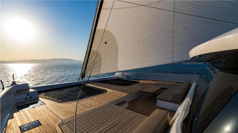 Endless Horizon II Yacht Photos Pics Luxurious Sunreef 80 Sail yacht deck at sunset, 2022 model, with expansive ocean views.