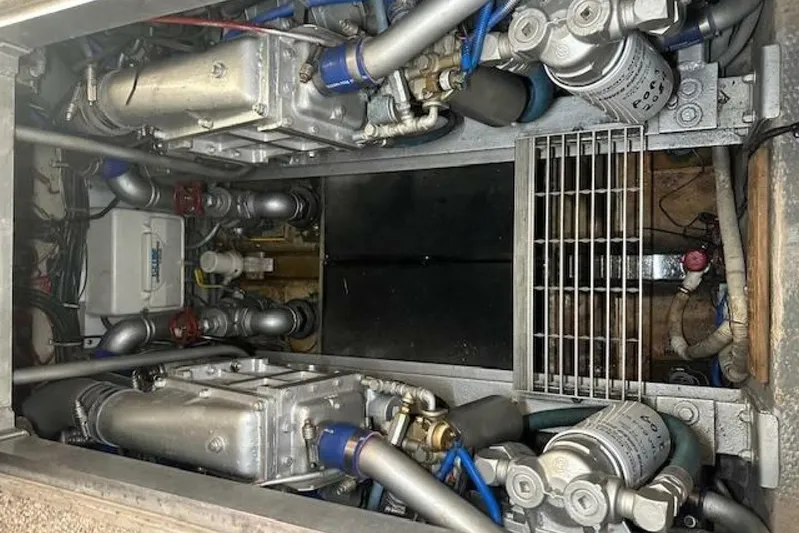  Yacht Photos Pics Engine room of a 1989 Viking 41 Sportfish Convertible boat, showcasing mechanical components.