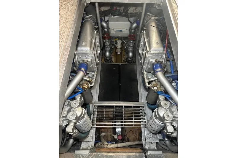  Yacht Photos Pics Engine room of a 1989 Viking 41 Sportfish Convertible boat, showcasing dual engines.