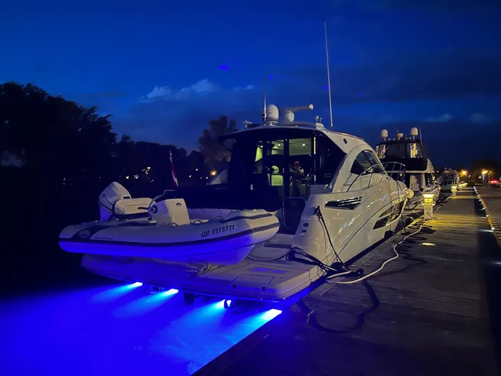 Flot D'amour Xx Yacht Photos Pics 2014 Sea Ray 510 Sundancer yacht docked at night with blue underwater lights.
