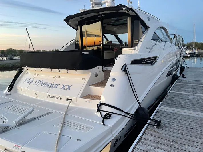 Flot D'amour Xx Yacht Photos Pics 2014 Sea Ray 510 Sundancer yacht docked at sunset, featuring sleek design and spacious deck.