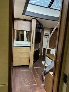 Flot D'amour Xx Yacht Photos Pics Interior of 2014 Sea Ray 510 Sundancer yacht with modern wood finishes and skylight.