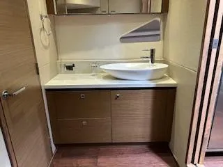 Flot D'amour Xx Yacht Photos Pics 2014 Sea Ray 510 Sundancer bathroom with modern sink and wooden cabinetry.