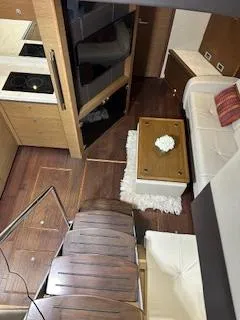 Flot D'amour Xx Yacht Photos Pics Interior of 2014 Sea Ray 510 Sundancer yacht with modern kitchen and cozy seating area.