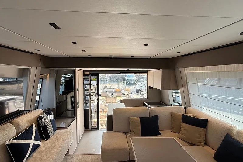 Aslid Yacht Photos Pics Luxurious interior of 2025 Ferretti Yachts 580 with elegant seating and modern design.