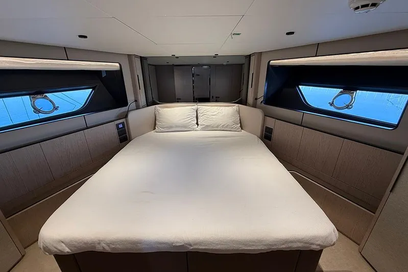 Aslid Yacht Photos Pics Luxurious bedroom interior of 2025 Ferretti Yachts 580 with modern design and large windows.