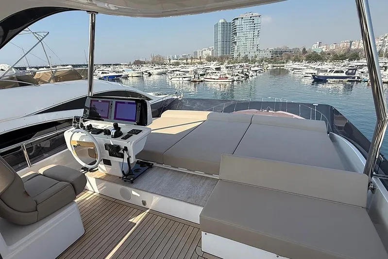 Aslid Yacht Photos Pics Luxurious 2025 Ferretti Yachts 580 with spacious deck and modern helm, docked at marina.