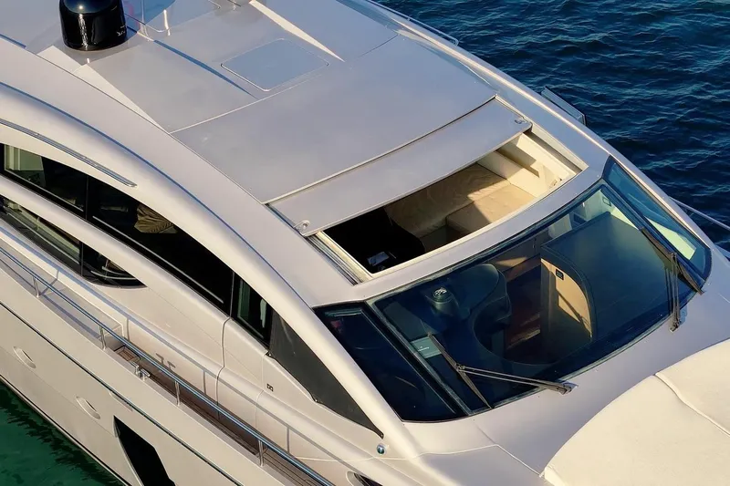 Freedom 2 Yacht Photos Pics 2010 Pershing 72 yacht, sleek design, aerial view, cruising on blue water.