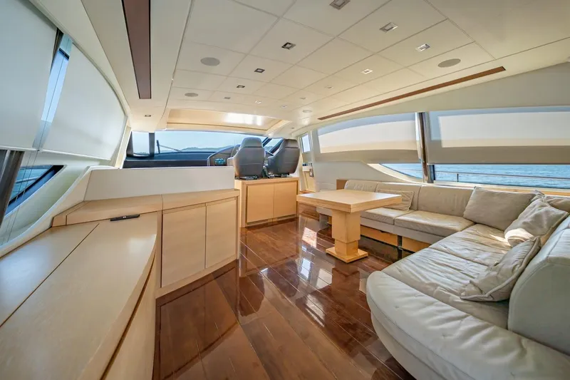 Freedom 2 Yacht Photos Pics Luxurious interior of 2010 Pershing 72 yacht with elegant seating and panoramic windows.