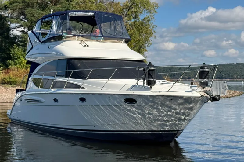 Old Hickory Yacht Photos Pics 2008 Meridian 391 Sedan yacht on calm water, surrounded by scenic nature.