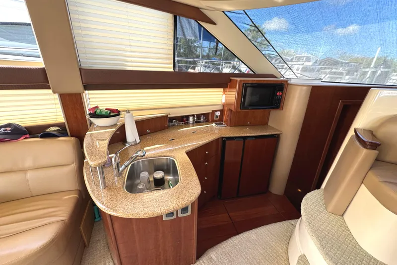 Old Hickory Yacht Photos Pics Luxurious 2008 Meridian 391 Sedan yacht interior with kitchenette and seating area.