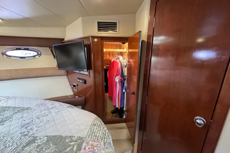 Old Hickory Yacht Photos Pics Interior of 2008 Meridian 391 Sedan with closet, TV, and bed.