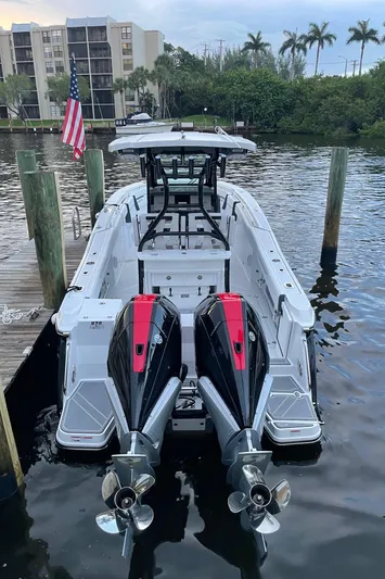  Yacht Photos Pics 2022 Blackfin 272 CC boat docked with twin outboard engines.