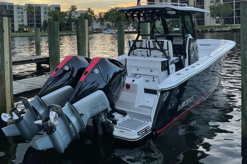  Yacht Photos Pics 2022 Blackfin 272 CC boat docked with twin outboard engines.