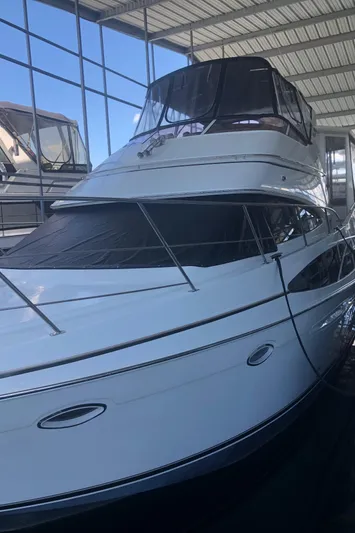 Agape III Yacht Photos Pics 2005 Carver 41 Cockpit Motor Yacht in a covered marina.