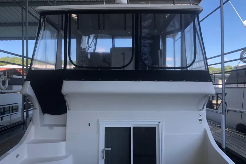 Agape III Yacht Photos Pics 2005 Carver 41 Cockpit Motor Yacht with enclosed upper deck.