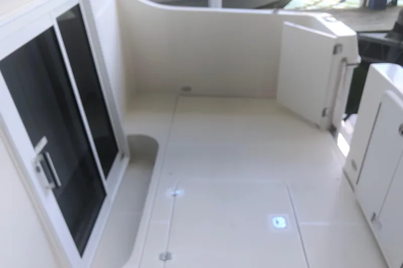 Agape III Yacht Photos Pics 2005 Carver 41 Cockpit Motor Yacht, spacious cockpit area with sliding glass doors.