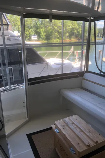 Agape III Yacht Photos Pics 2005 Carver 41 Cockpit Motor Yacht interior with seating and lake view.