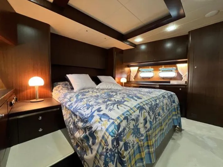  Yacht Photos Pics Luxurious bedroom interior on 2008 Horizon Elegance 90 Mega yacht, featuring elegant wood finishes.