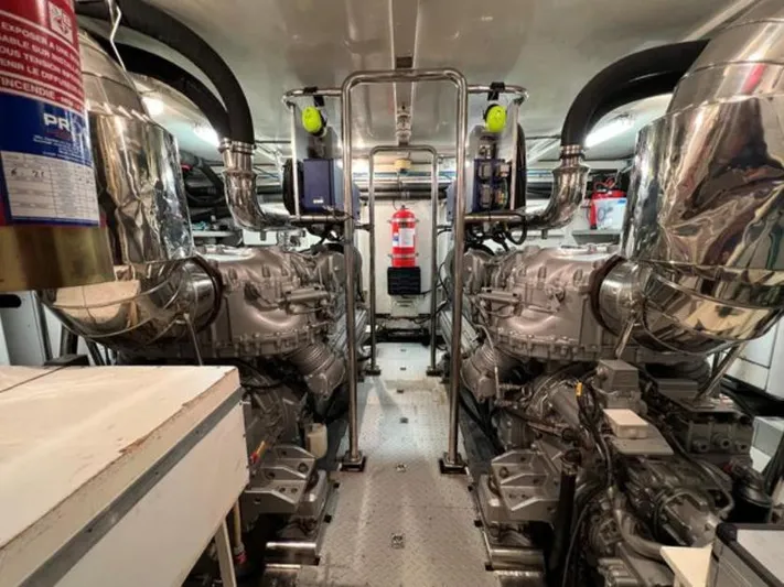  Yacht Photos Pics Engine room of 2008 Horizon Elegance 90 Mega yacht, featuring dual engines and fire safety equipment.