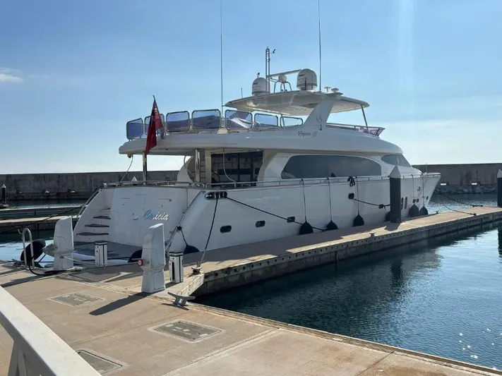  Yacht Photos Pics Luxury yacht Horizon Elegance 90 Mega, 2008 model, docked at marina under clear sky.