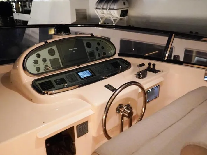  Yacht Photos Pics Helm of 2008 Horizon Elegance 90 Mega yacht with navigation controls and steering wheel.