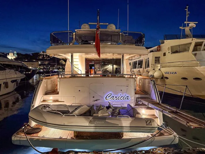 Yacht Photos Pics Luxury yacht "Caricia" docked at night, Horizon Elegance 90 Mega, 2008 model.