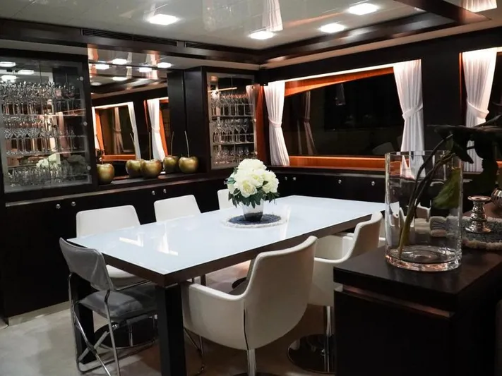  Yacht Photos Pics Luxurious dining area on 2008 Horizon Elegance 90 Mega yacht with elegant decor and white chairs.