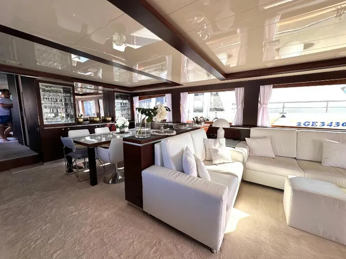  Yacht Photos Pics Luxurious interior of 2008 Horizon Elegance 90 Mega yacht with white seating and dining area.