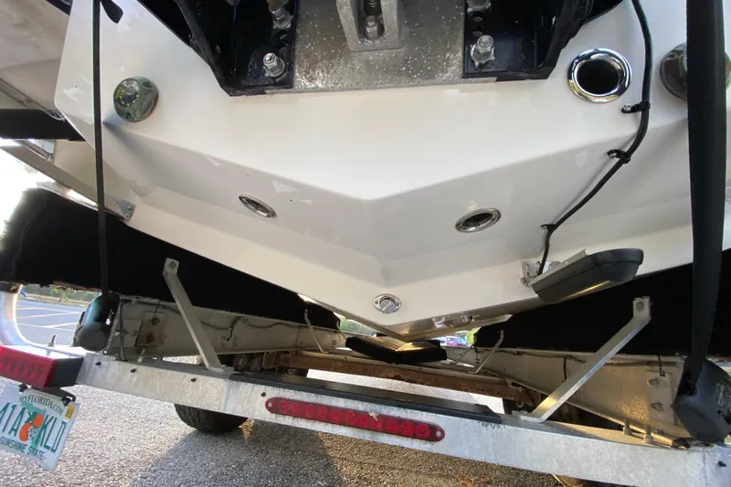  Yacht Photos Pics 2020 Pathfinder 2500 Hybrid boat on trailer, rear view showing hull and fittings.