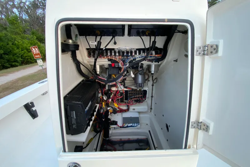 Yacht Photos Pics Electrical compartment of a 2020 Pathfinder 2500 Hybrid boat, showcasing wiring and components.