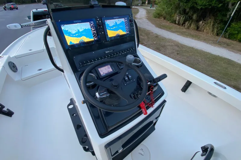  Yacht Photos Pics 2020 Pathfinder 2500 Hybrid boat console with dual Simrad displays and steering wheel.