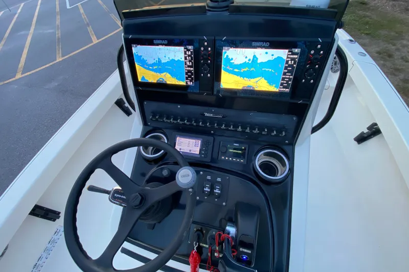  Yacht Photos Pics Pathfinder 2500 Hybrid 2020 boat dashboard with dual Simrad displays and steering wheel.