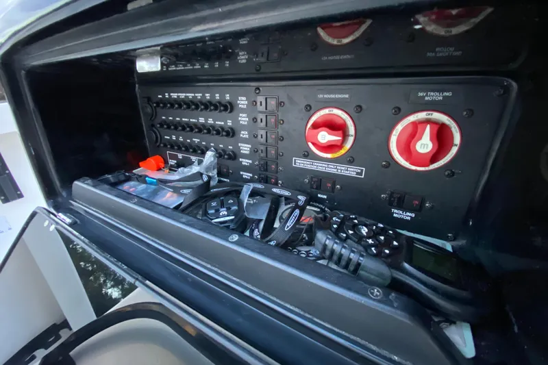  Yacht Photos Pics Control panel of a 2020 Pathfinder 2500 Hybrid boat with switches and dials.