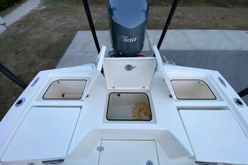  Yacht Photos Pics 2020 Pathfinder 2500 Hybrid boat deck with open storage compartments and Yamaha 300 engine.