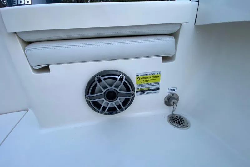  Yacht Photos Pics 2020 Pathfinder 2500 Hybrid boat interior with speaker, seating, and capacity label.