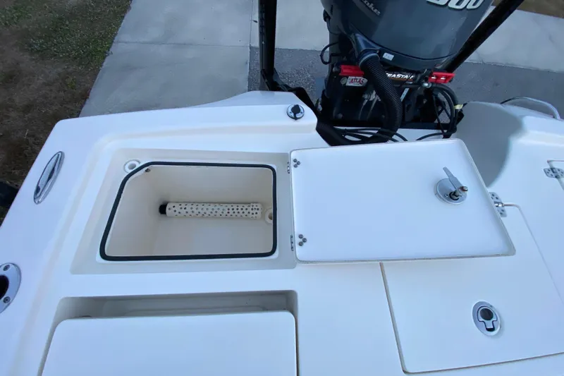  Yacht Photos Pics 2020 Pathfinder 2500 Hybrid boat with open storage compartments and outboard motor.