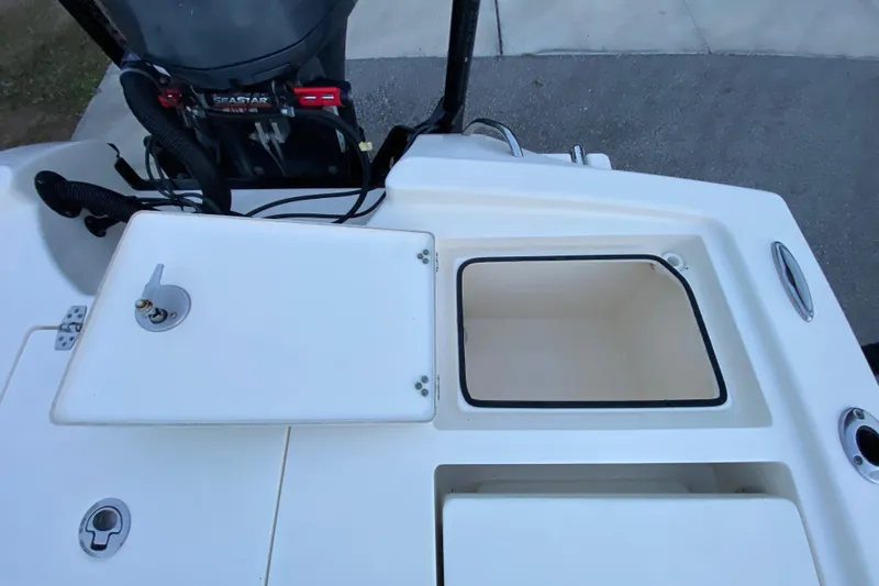  Yacht Photos Pics Pathfinder 2500 Hybrid 2020 boat deck with storage compartments and engine view.