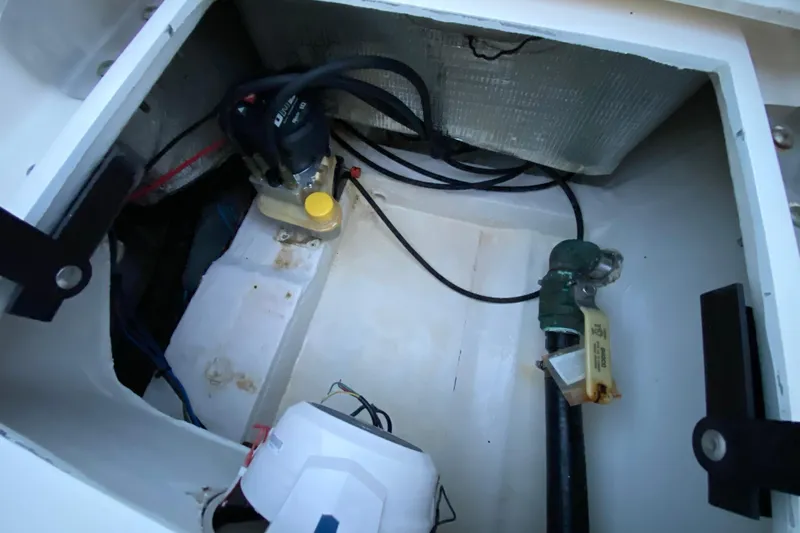  Yacht Photos Pics 2020 Pathfinder 2500 Hybrid boat compartment with pump and wiring.