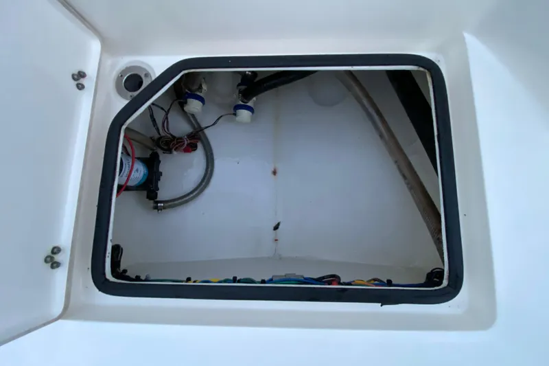  Yacht Photos Pics Pathfinder 2500 Hybrid 2020 boat compartment with wiring and pump system.