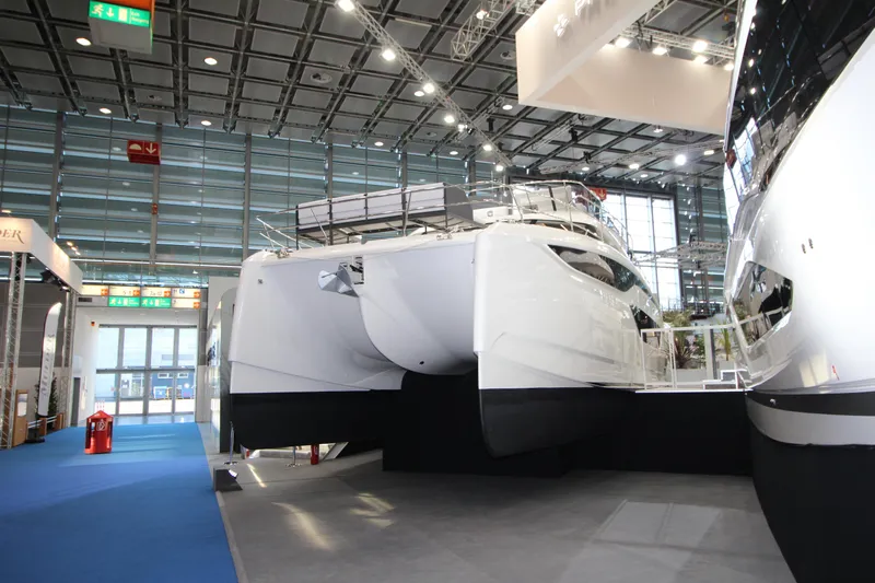  Yacht Photos Pics Prestige M48 2025 yacht displayed indoors at a boat show.