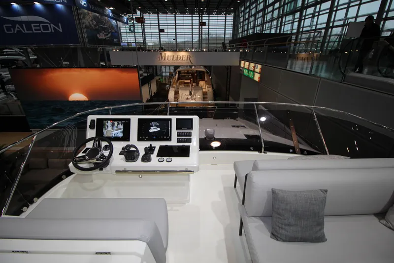  Yacht Photos Pics Prestige M48 yacht interior, 2025 model, featuring modern helm and seating area.