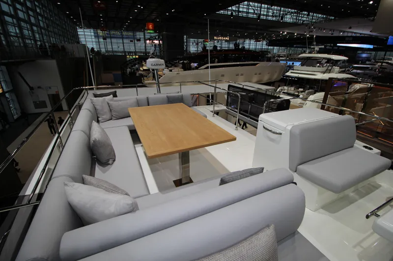  Yacht Photos Pics Luxurious seating area on 2025 Prestige M48 yacht, featuring elegant design and spacious layout.