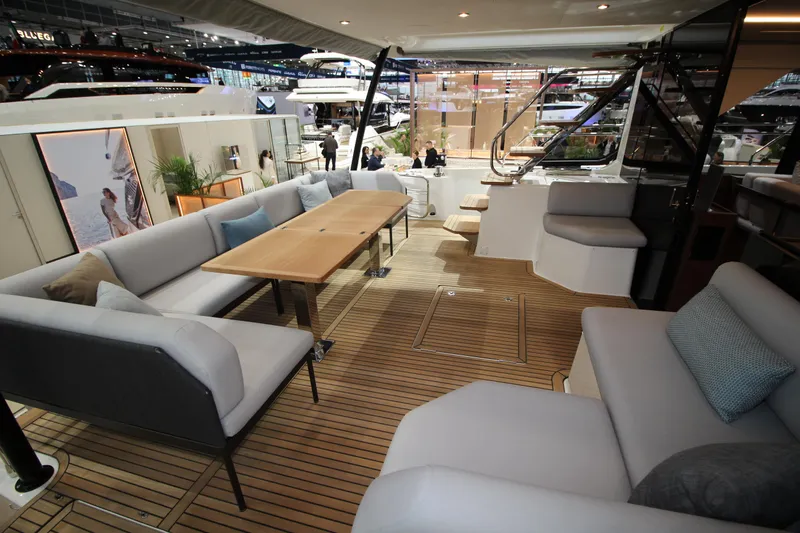  Yacht Photos Pics Luxurious interior of 2025 Prestige M48 yacht with elegant seating and wooden flooring.