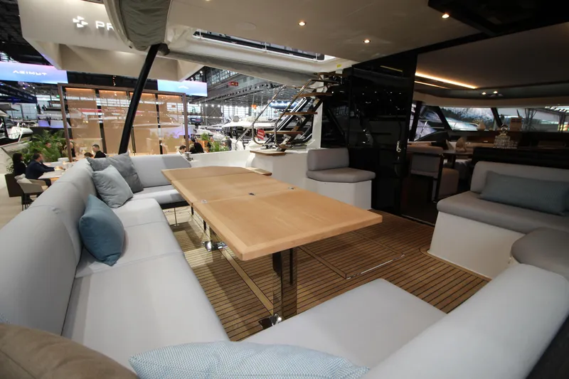  Yacht Photos Pics Luxurious interior of 2025 Prestige M48 yacht with spacious seating and elegant wooden table.