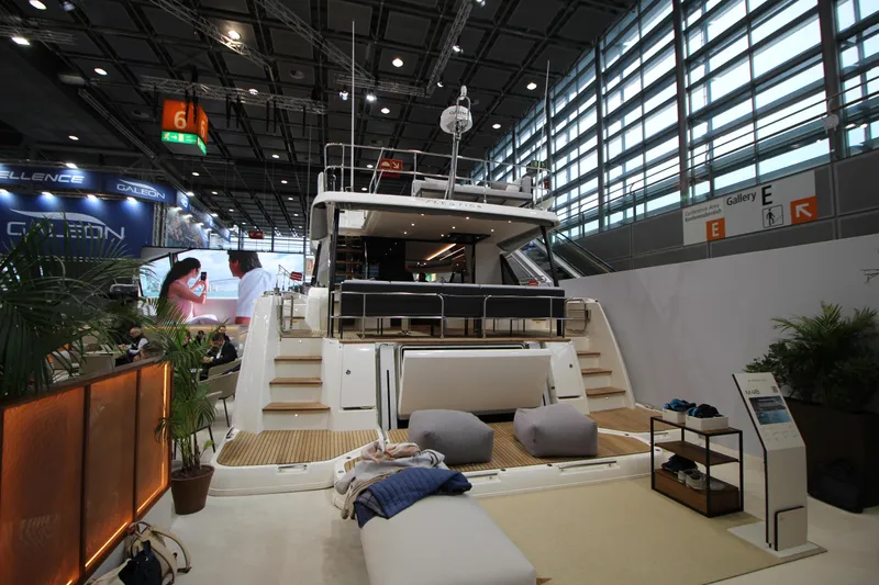  Yacht Photos Pics Luxury Prestige M48 yacht displayed at a 2025 boat show, featuring elegant design and modern amenities.