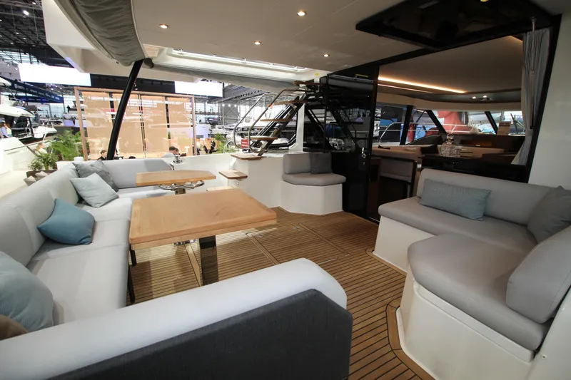  Yacht Photos Pics Luxurious 2025 Prestige M48 yacht interior with elegant seating and wooden flooring.