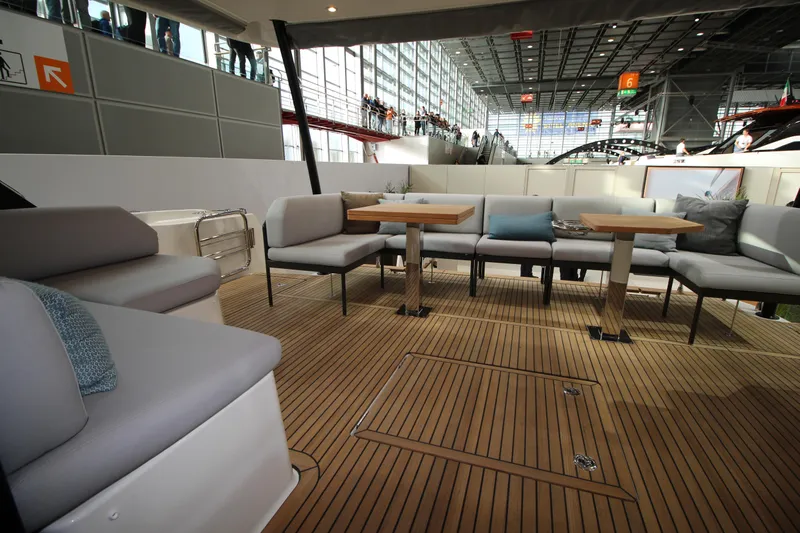  Yacht Photos Pics Luxurious 2025 Prestige M48 yacht interior with elegant seating and wooden flooring.