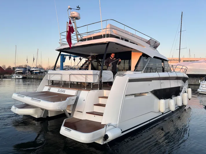  Yacht Photos Pics Luxury Prestige M48 yacht, 2025 model, docked at marina during sunset.